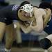 Saline Nate O'Sullivan wrestles Pioneer Robert Freter on Wednesday, Feb. 6. Daniel Brenner I AnnArbor.com